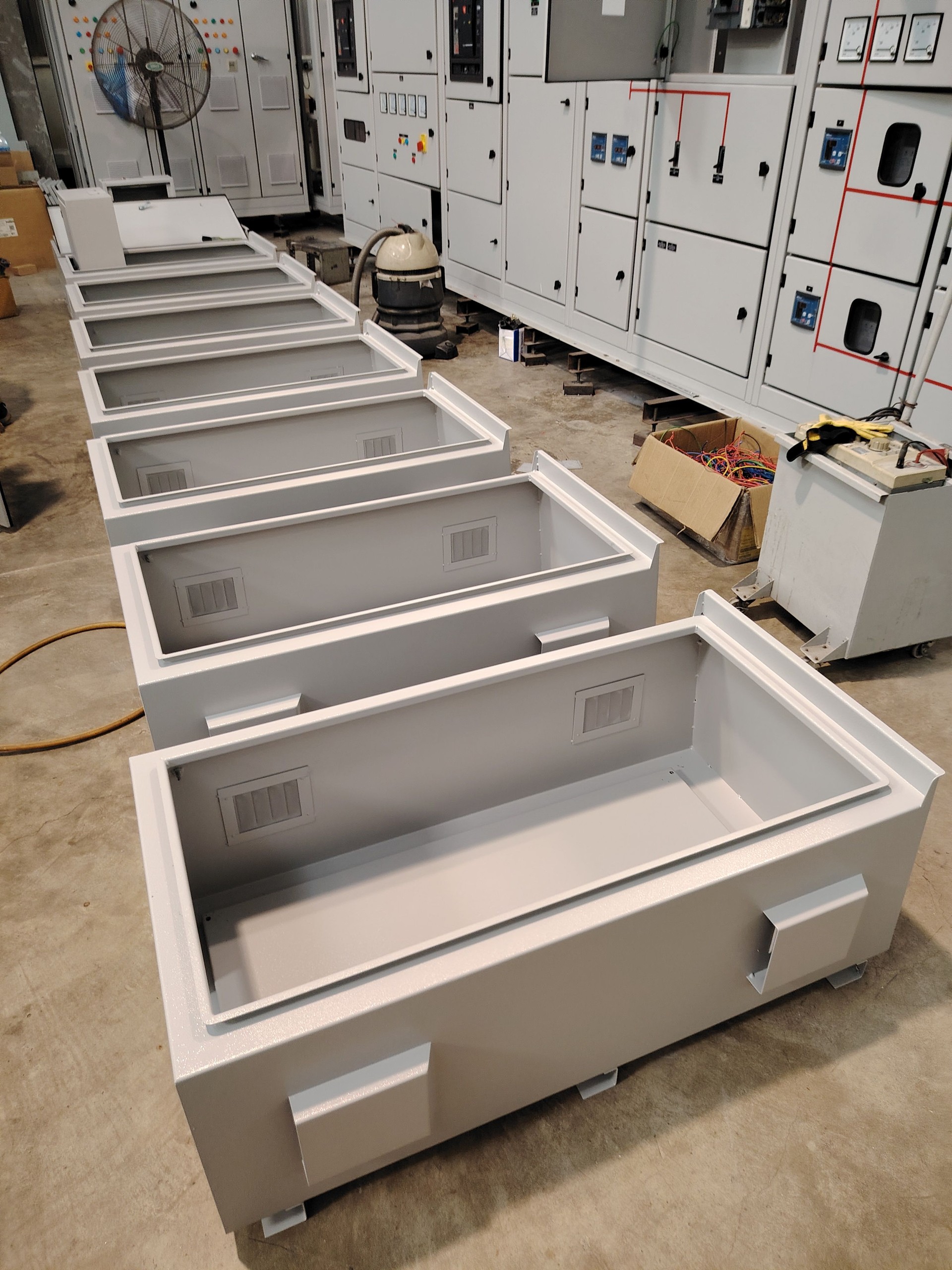 Image of empty electrical cabinet on the factory floor.