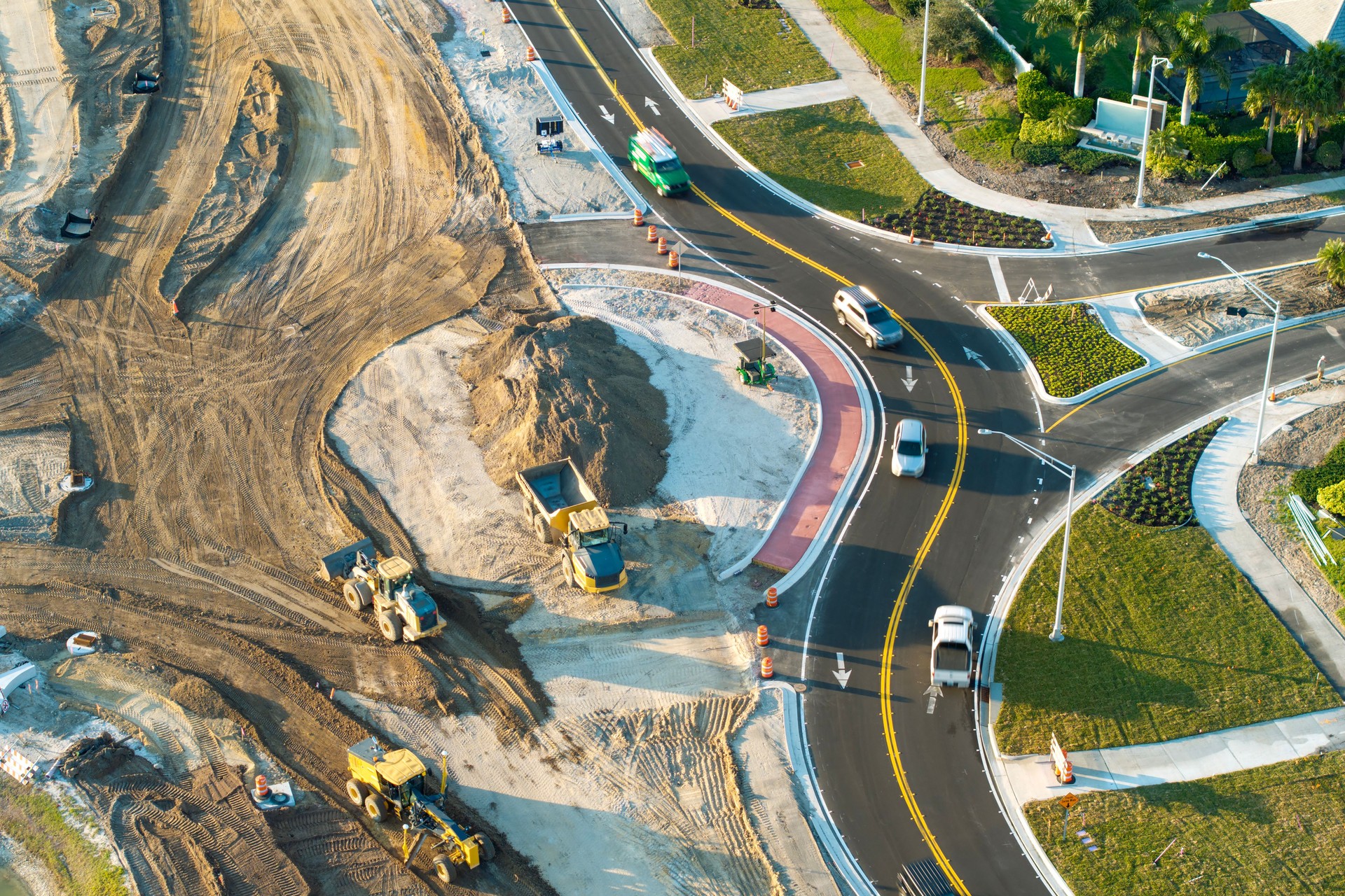 Roundabout construction roadworks on American transport infrastructure. Renovation of highway road with moving traffic. Development of interstate transportation concept