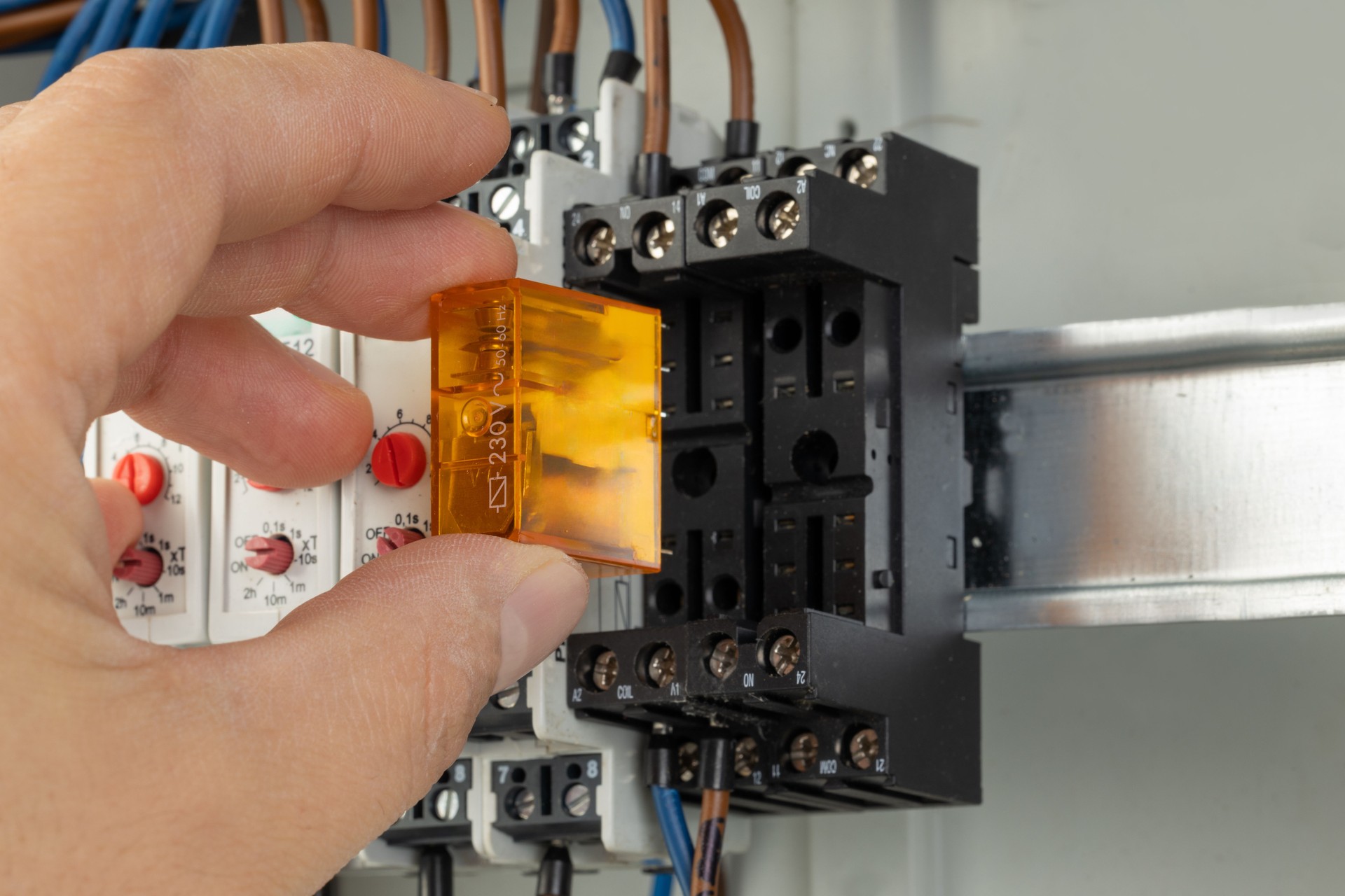 Inserting relay into electrical control panel