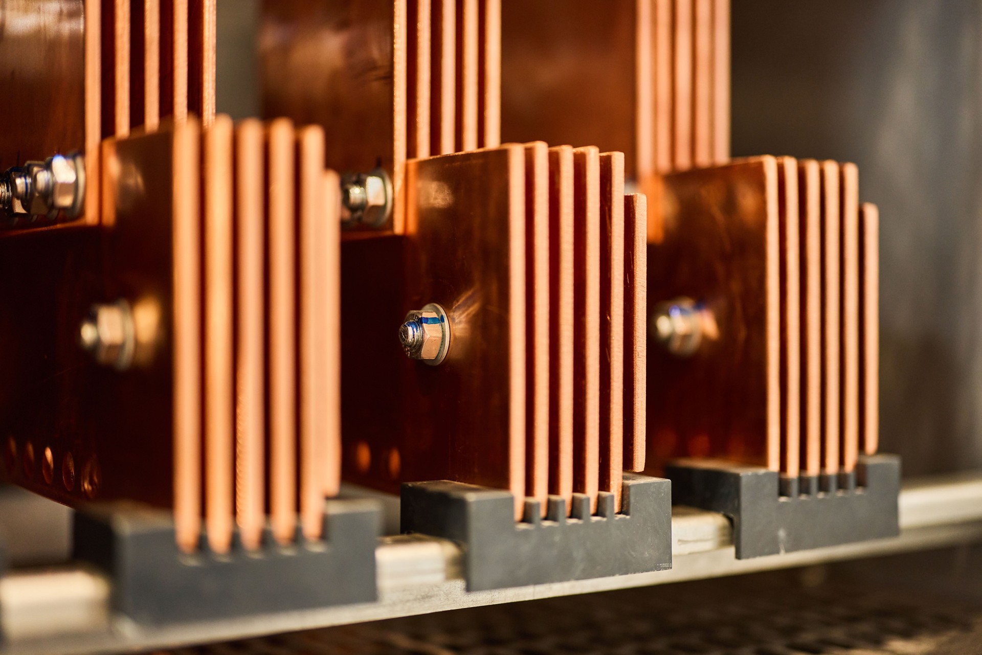 Close-Up View of Copper Busbars in Industrial Electrical Equipment for Power Distribution
